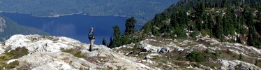 Hiker on Pierce Mountain Trail, Ross Lake in background